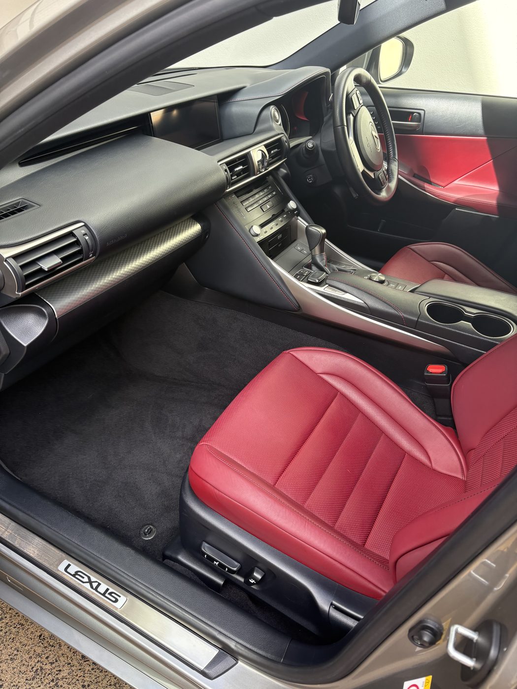 Red leather Lexus interior after a maintenance detail