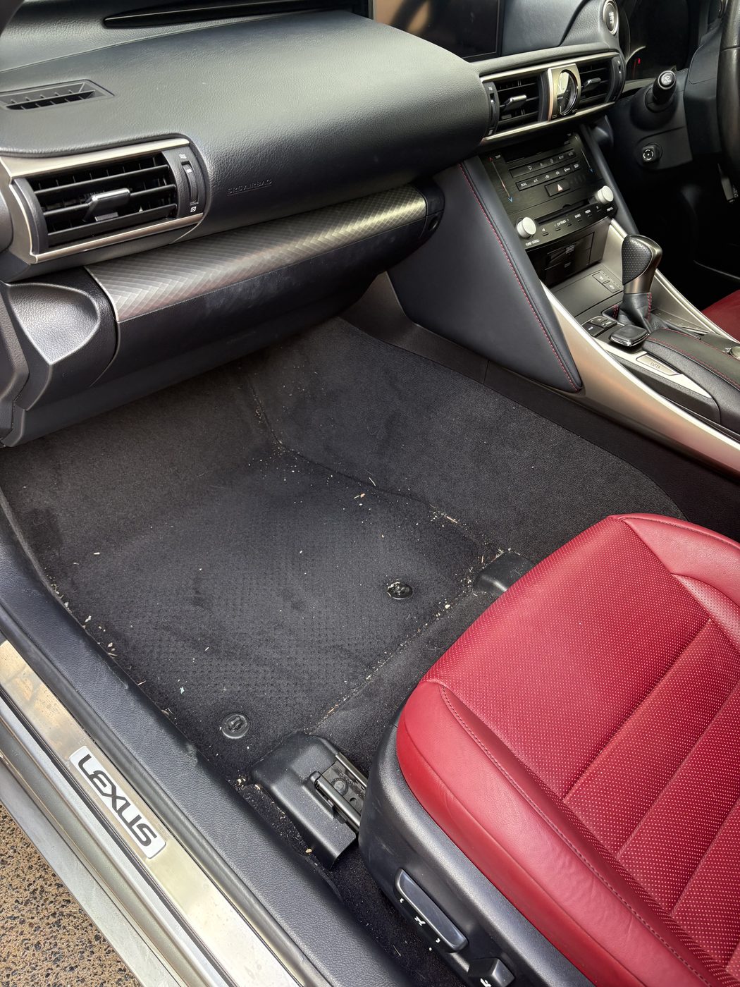 Red leather Lexus interior before a maintenance detail