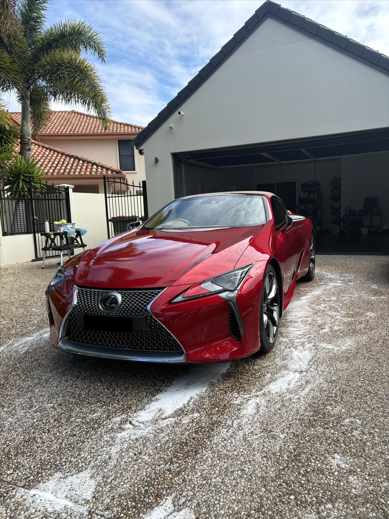 Freshly detailed red Lexus LC 500 during a mobile car detail on the Sunshine Coast